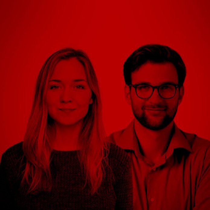 A man and a woman on a red background