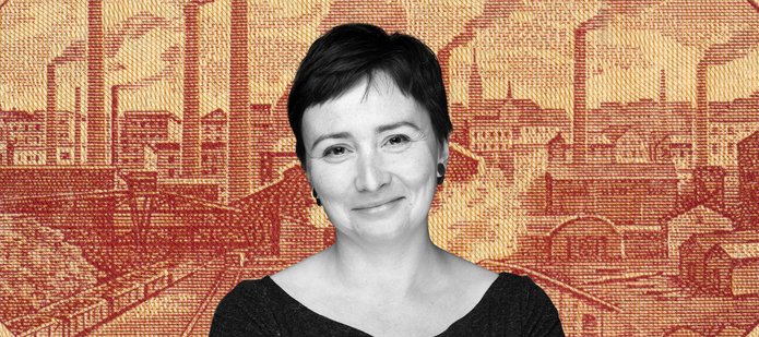 Dr Agata Zysiak against the background of a panorama of nineteenth-century Lodz printed on orange textile material