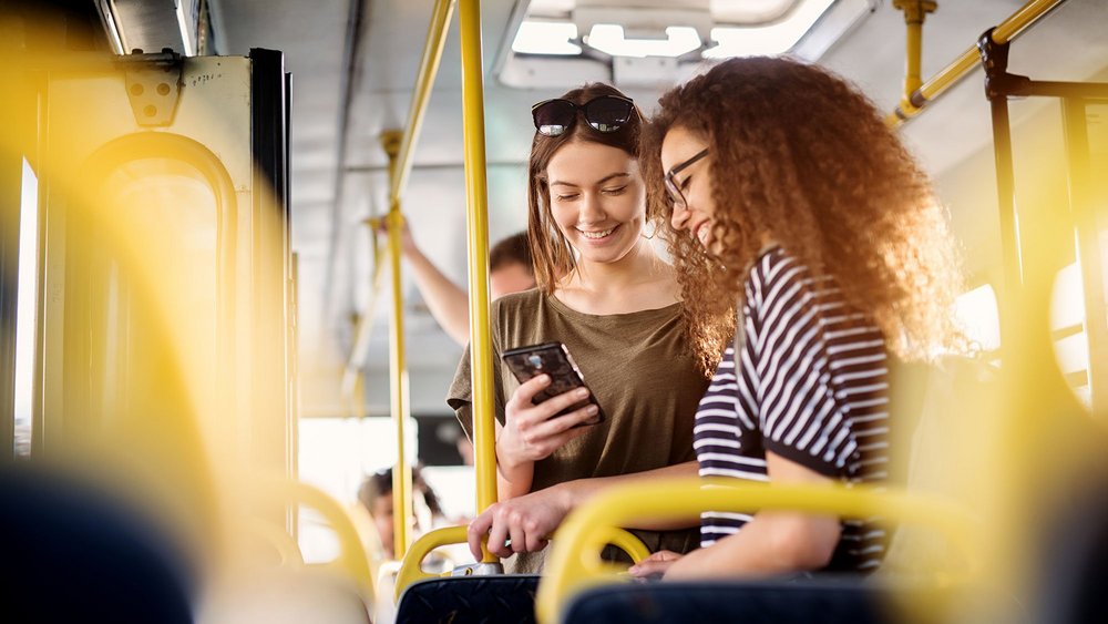 a decorative element: two young people on a bus