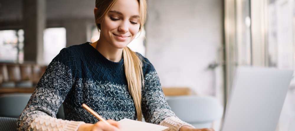 a woman taking notes