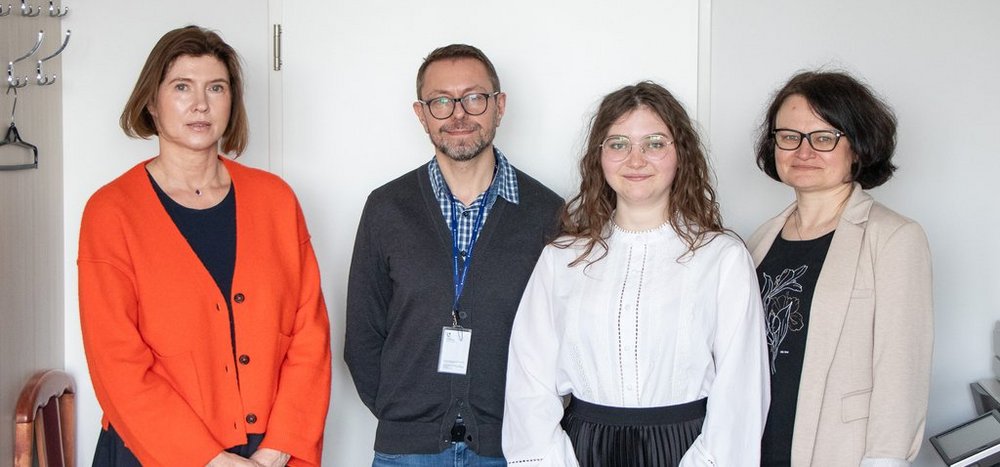 Oleksandra Korniiets with members of the examination committee