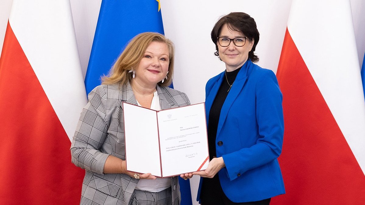 DTwo women holding the letter of appointment to the Legislative Council.